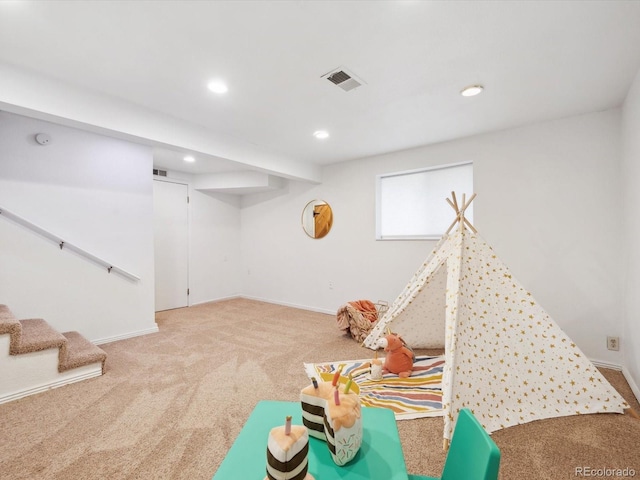 rec room featuring visible vents, baseboards, recessed lighting, and carpet