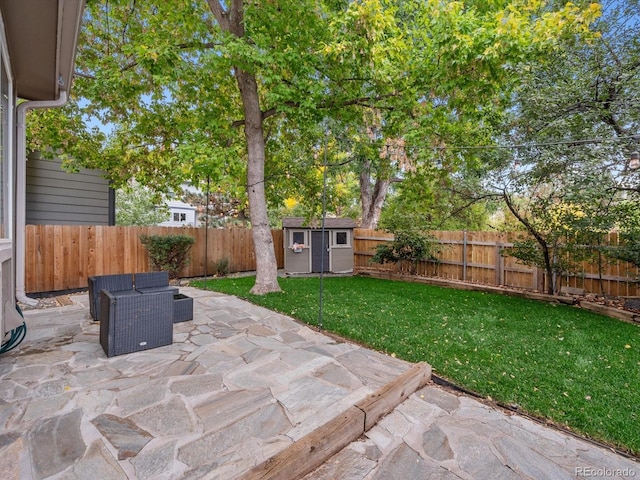 view of patio with a storage shed, a fenced backyard, and an outdoor structure