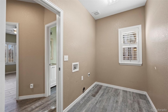 laundry room with visible vents, hookup for a washing machine, electric dryer hookup, and wood finished floors