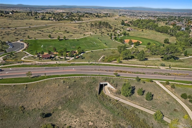 birds eye view of property with a rural view