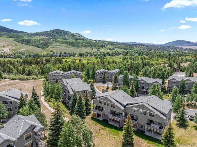 107 Mountain Vista Ln, Silverthorne, CO 80498 - aerial perspective of suburban area featuring mountains and a heavily wooded area