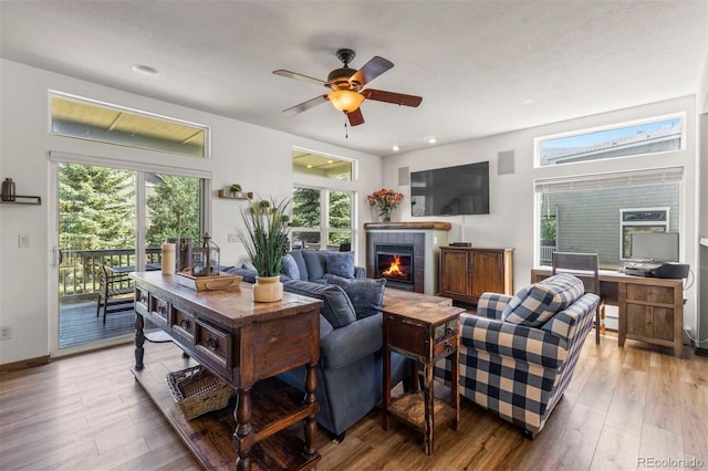 107 Mountain Vista Ln, Silverthorne, CO 80498 - living area featuring wood finished floors, a fireplace, ceiling fan, and recessed lighting