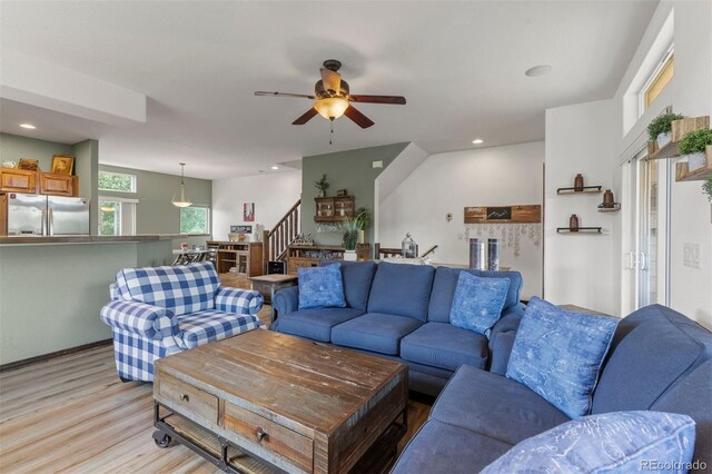 107 Mountain Vista Ln, Silverthorne, CO 80498 - living room with light wood-style flooring, ceiling fan, stairway, and recessed lighting