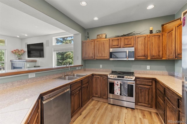 107 Mountain Vista Ln, Silverthorne, CO 80498 - kitchen with stainless steel appliances, light wood-style flooring, recessed lighting, light countertops, and brown cabinets