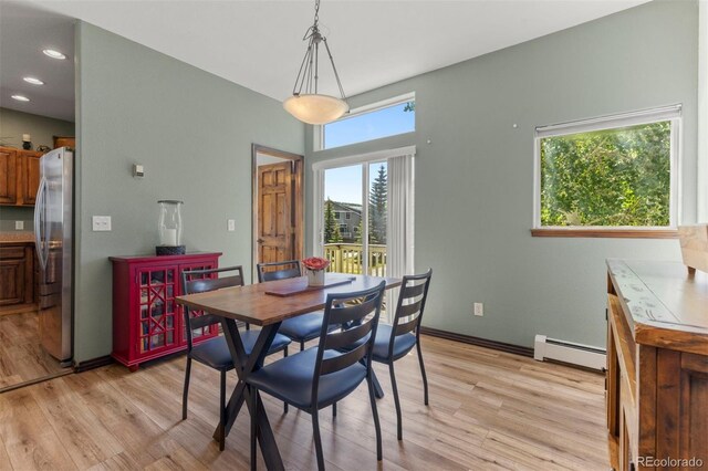 107 Mountain Vista Ln, Silverthorne, CO 80498 - dining space featuring baseboard heating, light wood-style flooring, and recessed lighting