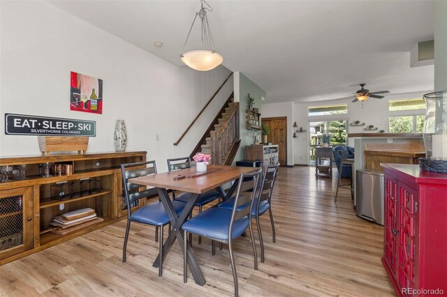 107 Mountain Vista Ln, Silverthorne, CO 80498 - dining room featuring stairway, light wood-type flooring, and ceiling fan