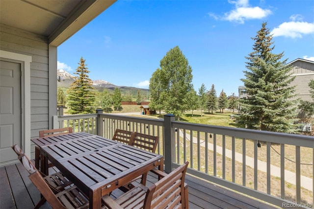 107 Mountain Vista Ln, Silverthorne, CO 80498 - wooden terrace featuring outdoor dining space and a mountain view
