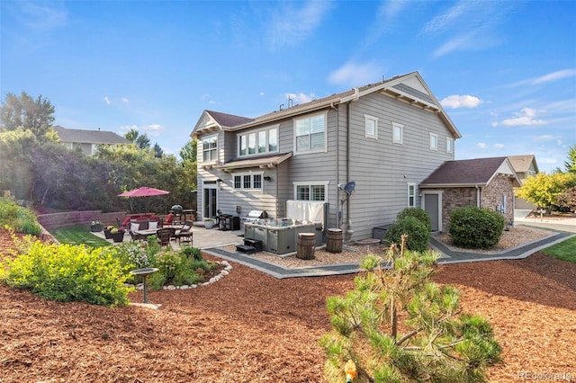 rear view of house featuring a patio area