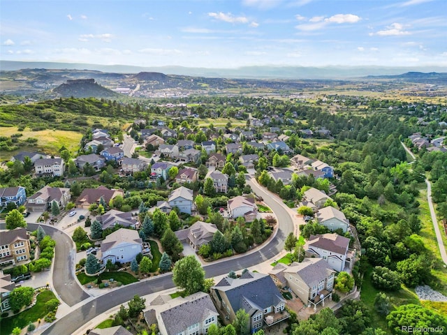 birds eye view of property featuring a mountain view