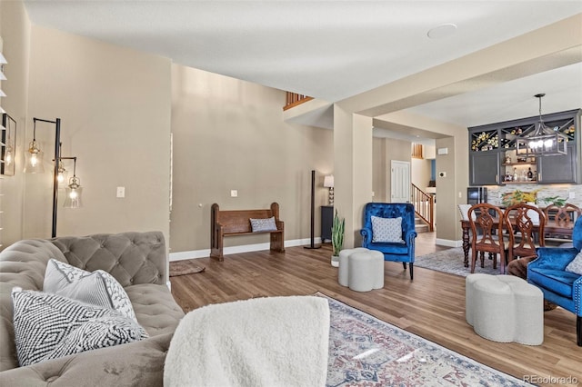 living room featuring hardwood / wood-style floors and a chandelier