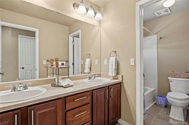 full bathroom featuring vanity, shower / tub combination, and toilet