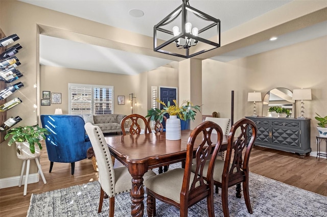 dining room with a chandelier and hardwood / wood-style floors