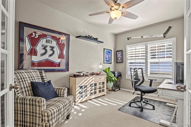 carpeted office with ceiling fan