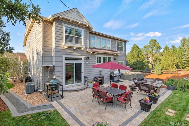 back of property featuring central AC unit and a patio area