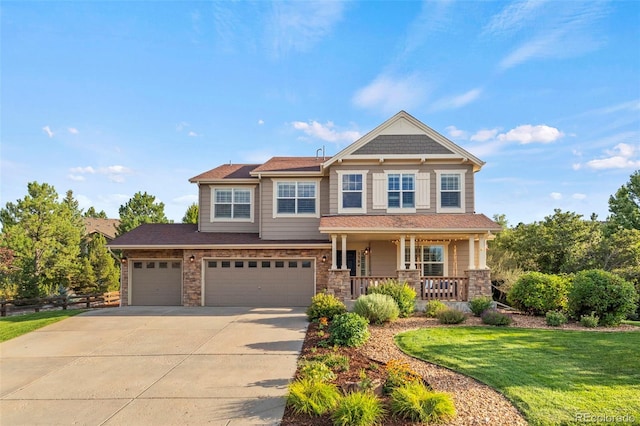 craftsman-style home with a porch, a garage, and a front lawn