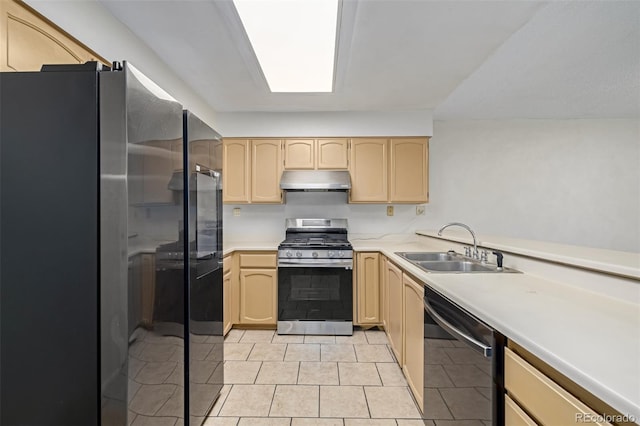 kitchen featuring sink, dishwasher, refrigerator, light brown cabinetry, and gas range