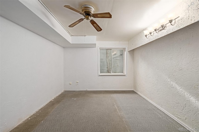 unfurnished room featuring carpet floors and ceiling fan