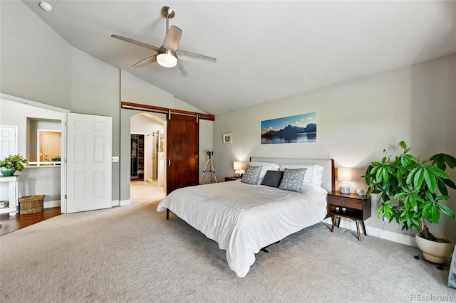 6776 Salvia Ct, Arvada, CO 80007 - carpeted bedroom featuring a barn door, lofted ceiling, baseboards, ceiling fan, and arched walkways