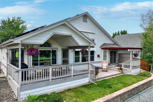 6776 Salvia Ct, Arvada, CO 80007 - rear view of property with a yard and a porch