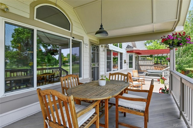 6776 Salvia Ct, Arvada, CO 80007 - wooden deck featuring a ceiling fan and outdoor dining area