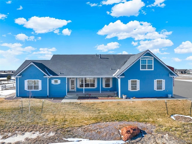 view of front of home featuring a front lawn and a porch