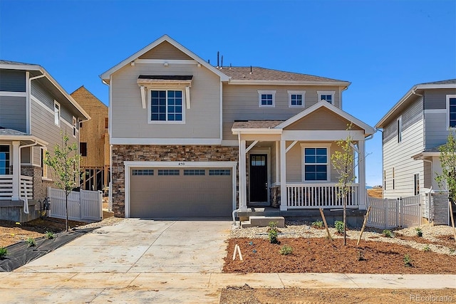 459 S Salida St, Aurora, CO 80017 - craftsman-style house with a porch, stone siding, a garage, and driveway