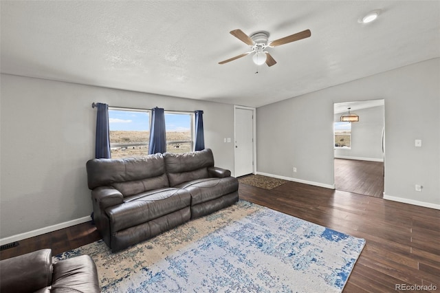 9765LAPINTURAPT La Pintura Pt, Fountain, CO 80817 - living room with a ceiling fan, baseboards, and wood finished floors