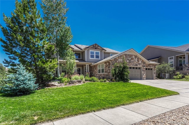 craftsman inspired home with a garage and a front lawn