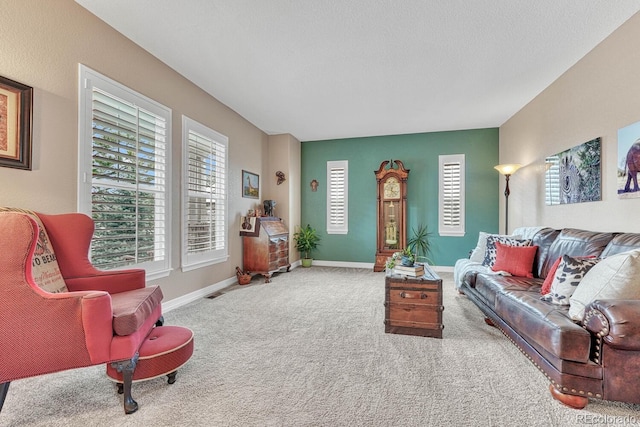 living room with carpet flooring and a textured ceiling