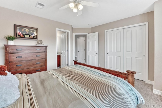 carpeted bedroom with a closet and ceiling fan