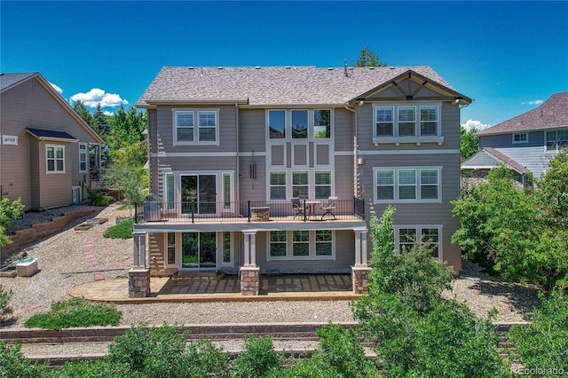 back of property with a patio area