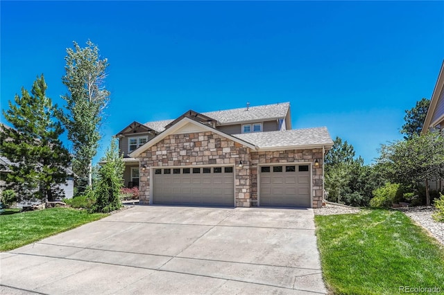 view of front of house with a garage and a front yard