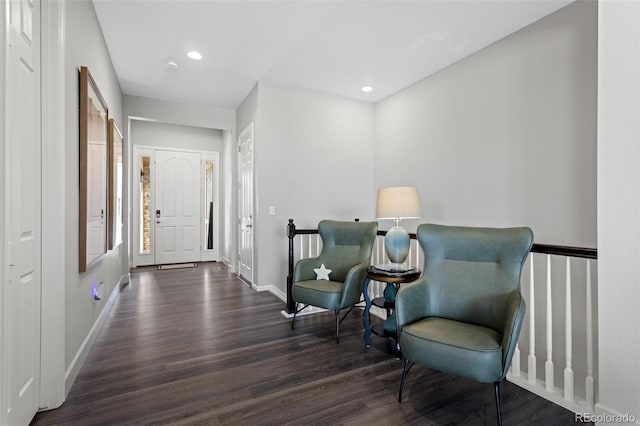 living area with dark hardwood / wood-style floors