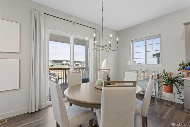 dining area featuring dark hardwood / wood-style floors