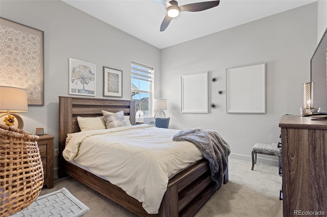 bedroom with ceiling fan and light carpet