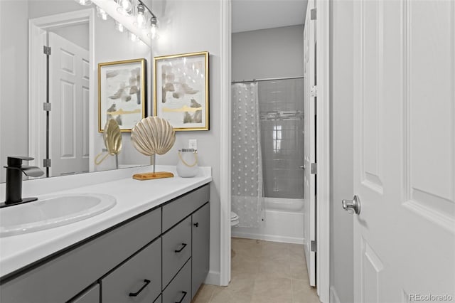 full bathroom featuring toilet, tile patterned floors, vanity, and shower / tub combo with curtain