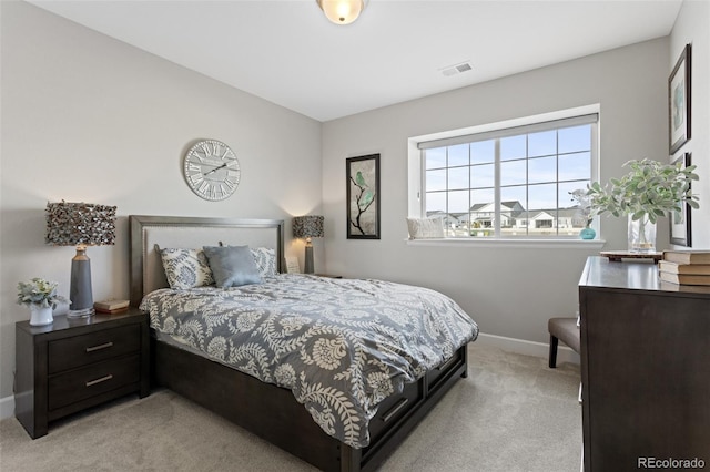 bedroom featuring light colored carpet