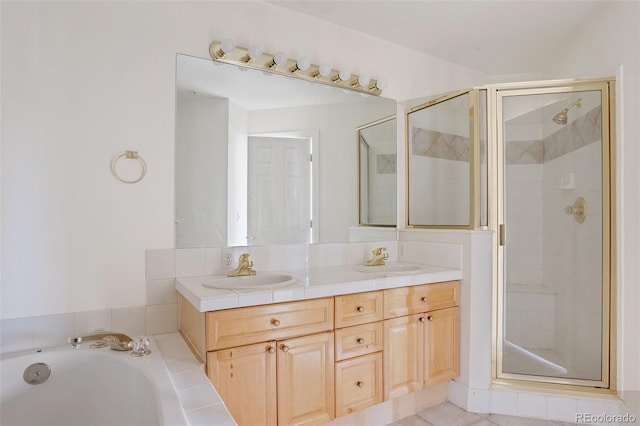 bathroom with double vanity, a sink, and a shower stall