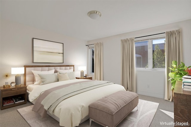 bedroom featuring light carpet