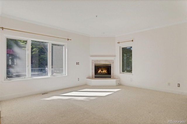 unfurnished living room featuring a fireplace, carpet, baseboards, visible vents, and ornamental molding
