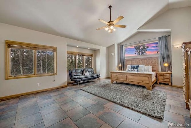 bedroom featuring baseboards, vaulted ceiling, and ceiling fan