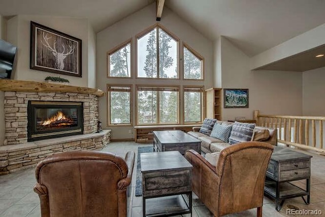 living area featuring high vaulted ceiling, a stone fireplace, tile patterned floors, and beamed ceiling