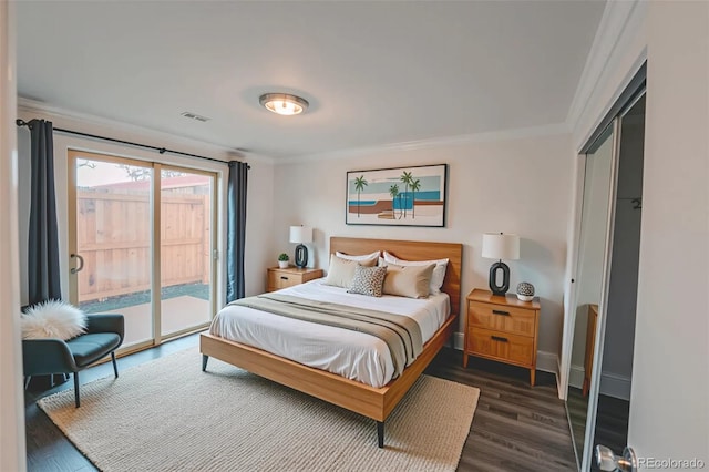 558 N Washington St Unit 103, Denver, CO 80203 - bedroom with crown molding, access to exterior, and dark wood-style flooring