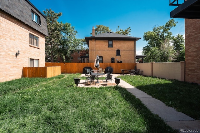 558 N Washington St Unit 103, Denver, CO 80203 - view of yard featuring a patio
