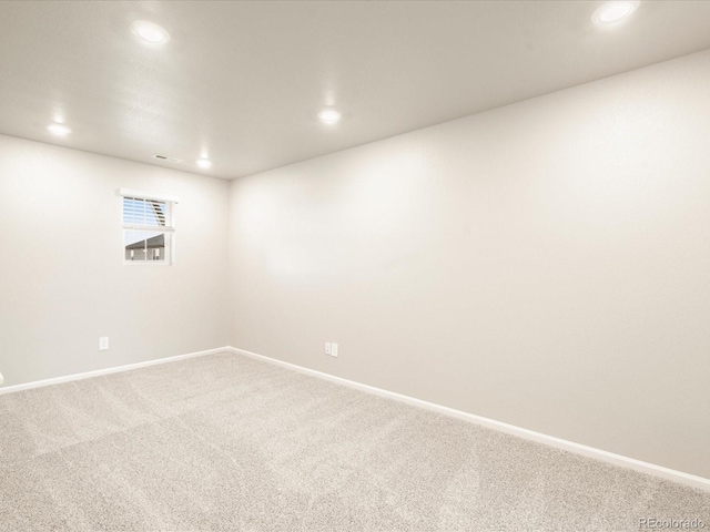 carpeted empty room with recessed lighting and baseboards