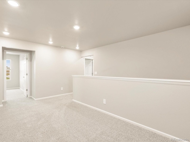 carpeted empty room with recessed lighting and baseboards