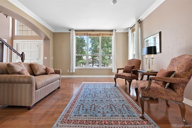 5120 Langdale Way, Colorado Springs, CO 80906 - living area featuring ornamental molding, wood finished floors, and stairs