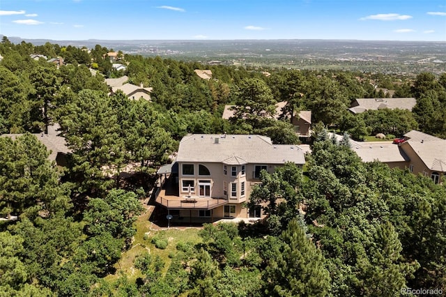 5120 Langdale Way, Colorado Springs, CO 80906 - aerial view of property and surrounding area featuring a forest