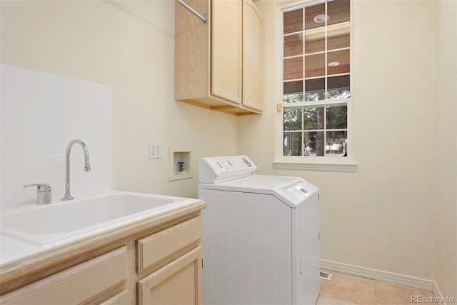 5120 Langdale Way, Colorado Springs, CO 80906 - laundry area with washer / clothes dryer, cabinet space, and light tile patterned floors