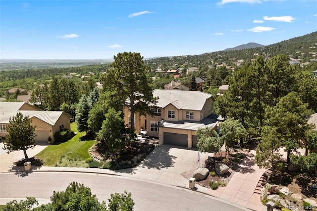 5120 Langdale Way, Colorado Springs, CO 80906 - view of subject property featuring a heavily wooded area and a mountainous background